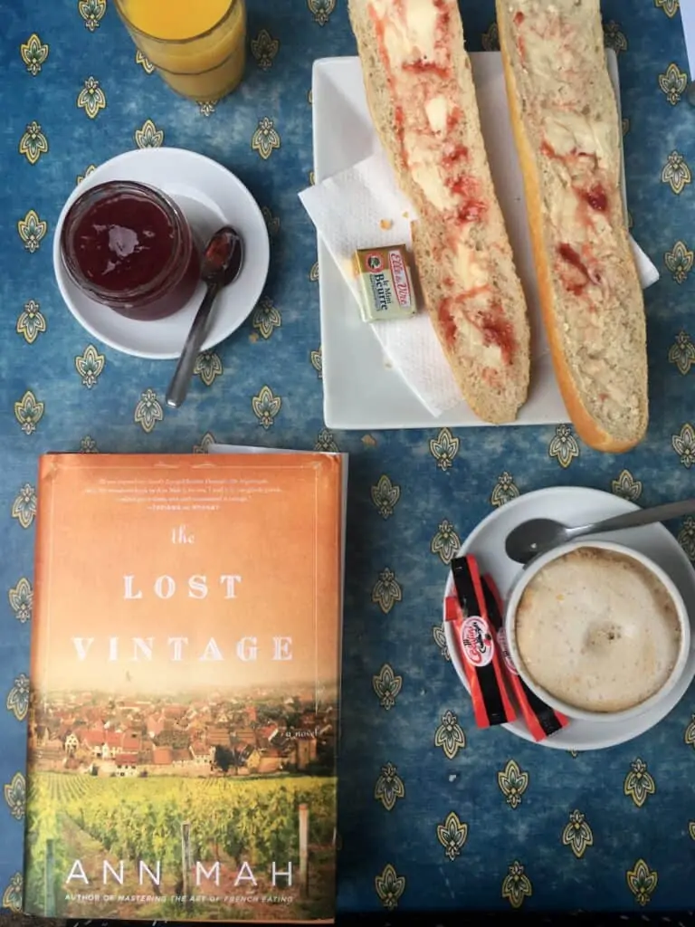 top view of jam, coffee, bread, and a book top view of jam, coffee, bread, and a book